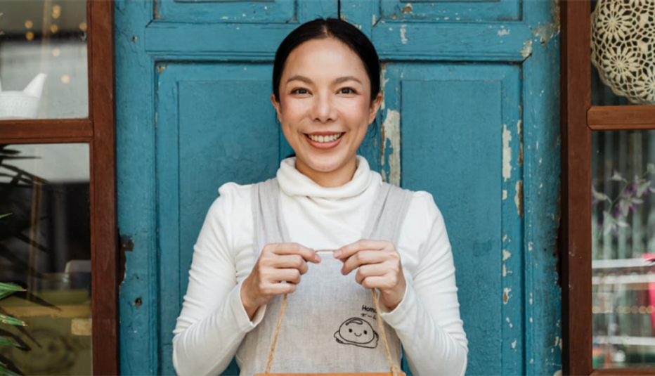 Maryland Auto IRA program worker smiling in front of door